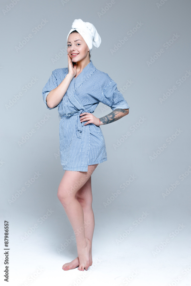 Young beautiful slim woman wrapped in towel Young beautiful slim woman wrapped in towel
