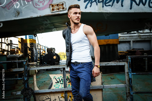 Attractive young man in white shirt outdoors