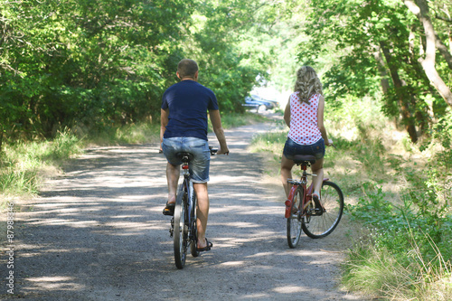  couple on bicycles  in the park