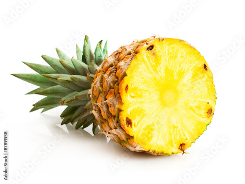 Pineapple with slices isolated on white
