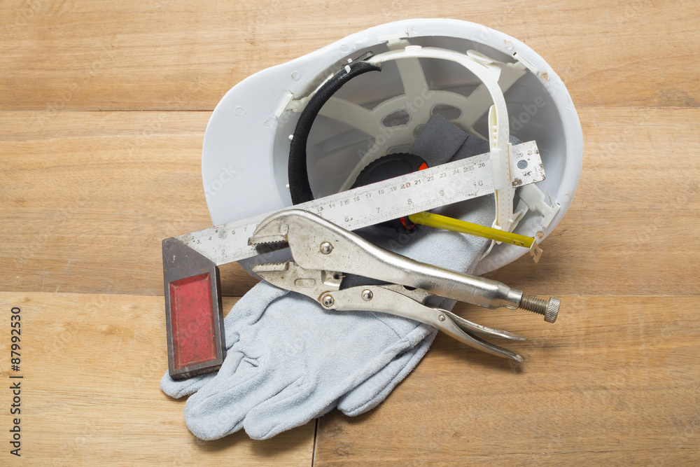 Fototapeta premium construction hat and gloves white backgrund