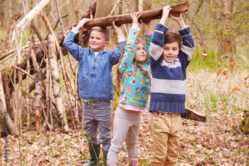 Obraz na płótnie Children Building Camp In Forest Together
