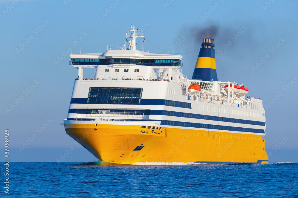Yellow passenger ship goes on the Sea