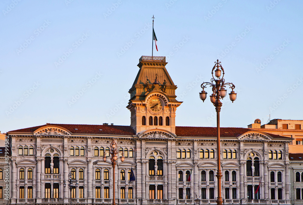 Fototapeta premium Trieste, Italy - Unity of Italy Square, detail of City Hall at sunset