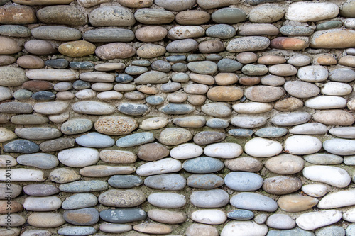 Fotografija Photo of the wall exactly paved with stones