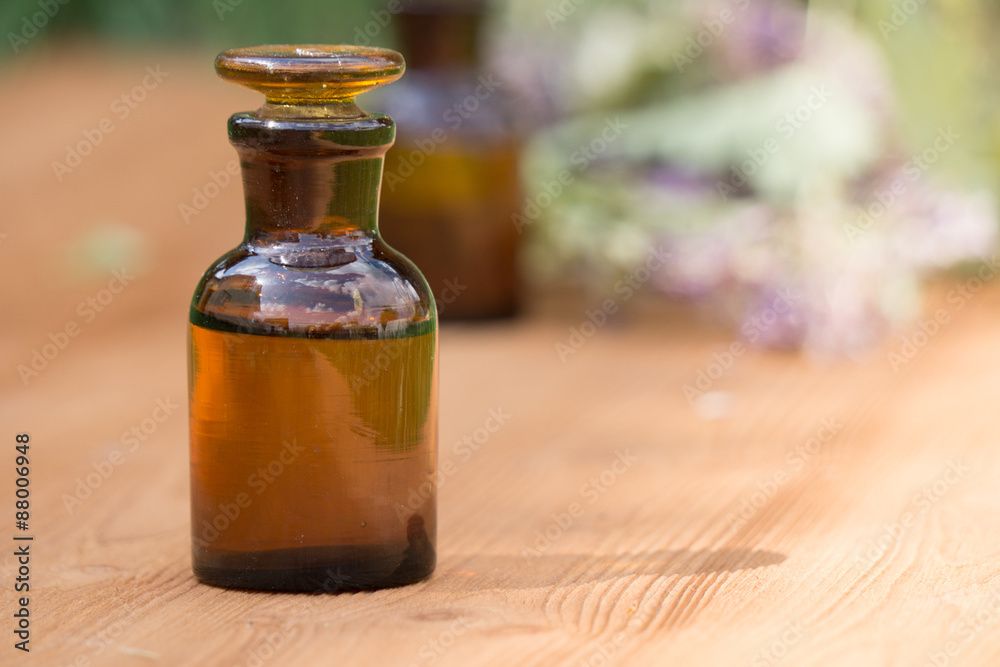essential oil in little bottle and medical flowers herbs essential oil in little bottle and medical flowers herbs