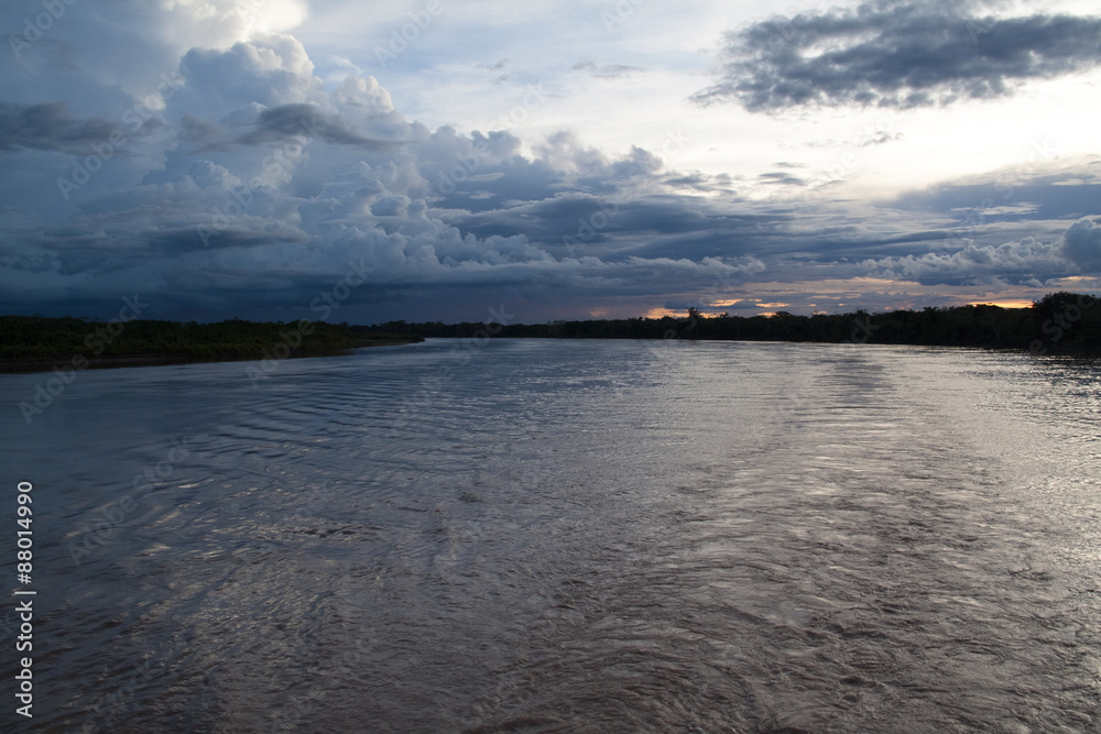 Fototapeta premium Sunset over the Amazon river near Iquitos, Peru 