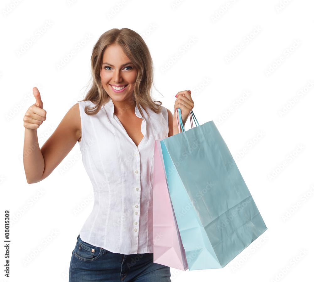 Smiling pretty woman with paper bags isolated on white Smiling pretty woman with paper bags isolated on white