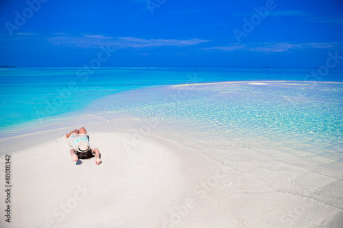 Young beautiful woman on beach during tropical vacation