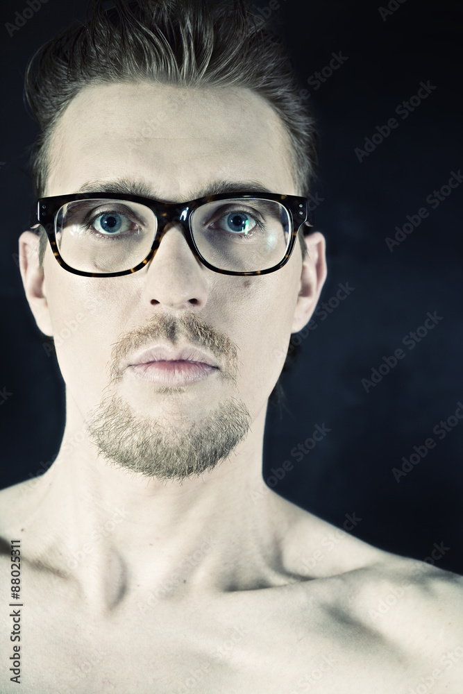 portrait of a young man in glasses portrait of a young man in glasses