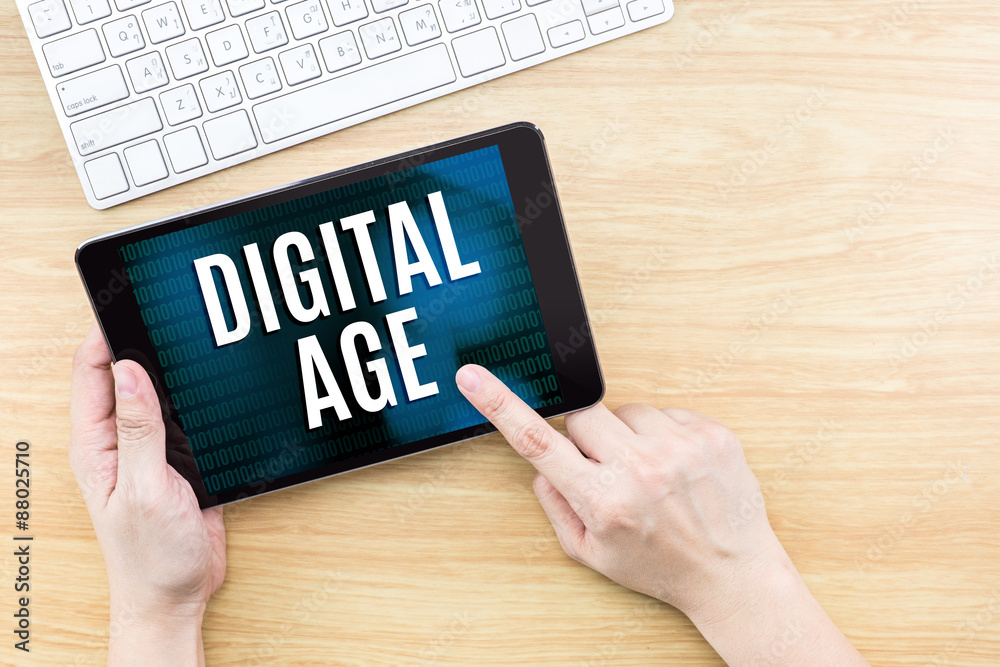 Finger click screen with Digital age word with keyboard on woode Finger click screen with Digital age word with keyboard on woode