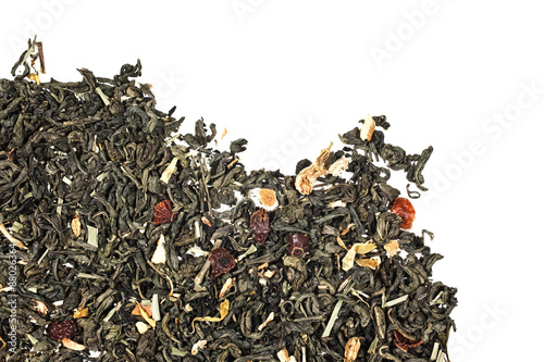 Texture of dry green tea with petals of flower and fruit