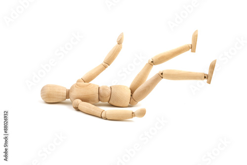 Laying wooden dummy isolated