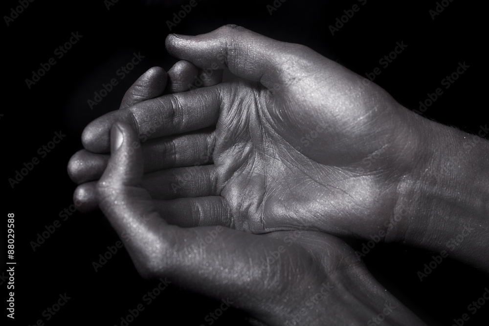 beautiful male hands in silver paint