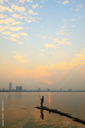 Fisher man on the west lake  hanoi  vietnam