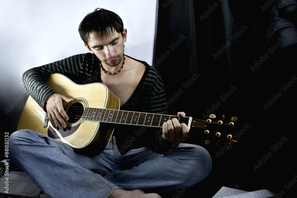 Obraz premium young man with a guitar