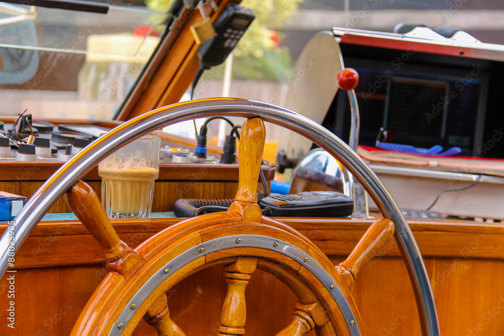 Ship helm in the captain's cabin of cruise boat