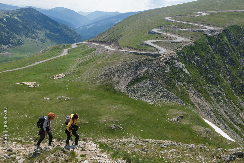 Fototapeta premium Two sister hiking into the mountains
