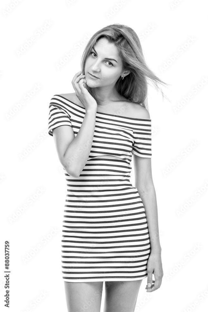 Girl in a striped dress on a white background.