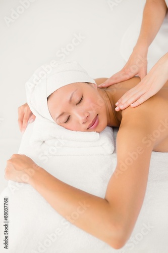 Attractive woman receiving back massage