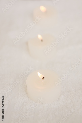 Close up of three lightened candles