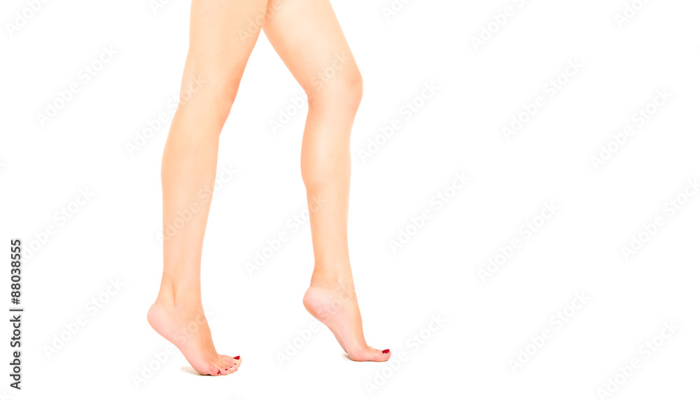 Slender beautiful female legs walking on tiptoe Slender beautiful female legs walking on tiptoe