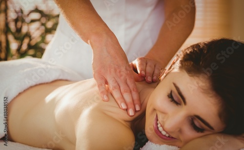 Young woman getting shoulder massage
