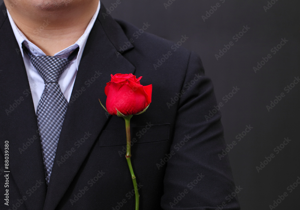 Red rose on suit. Red rose on suit.