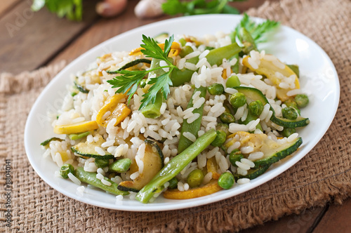 Risotto with asparagus beans, zucchini and green peas