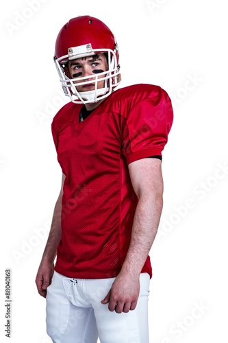 Serious american football player wearing a helmet