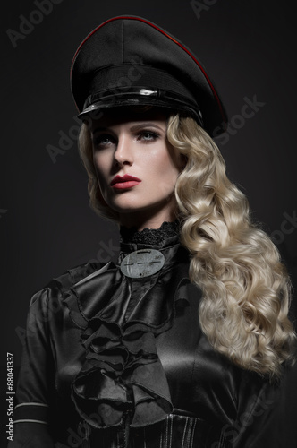 Beauty portrait of woman in military hat