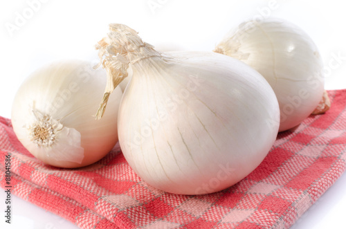 Fresh white onions on a towel