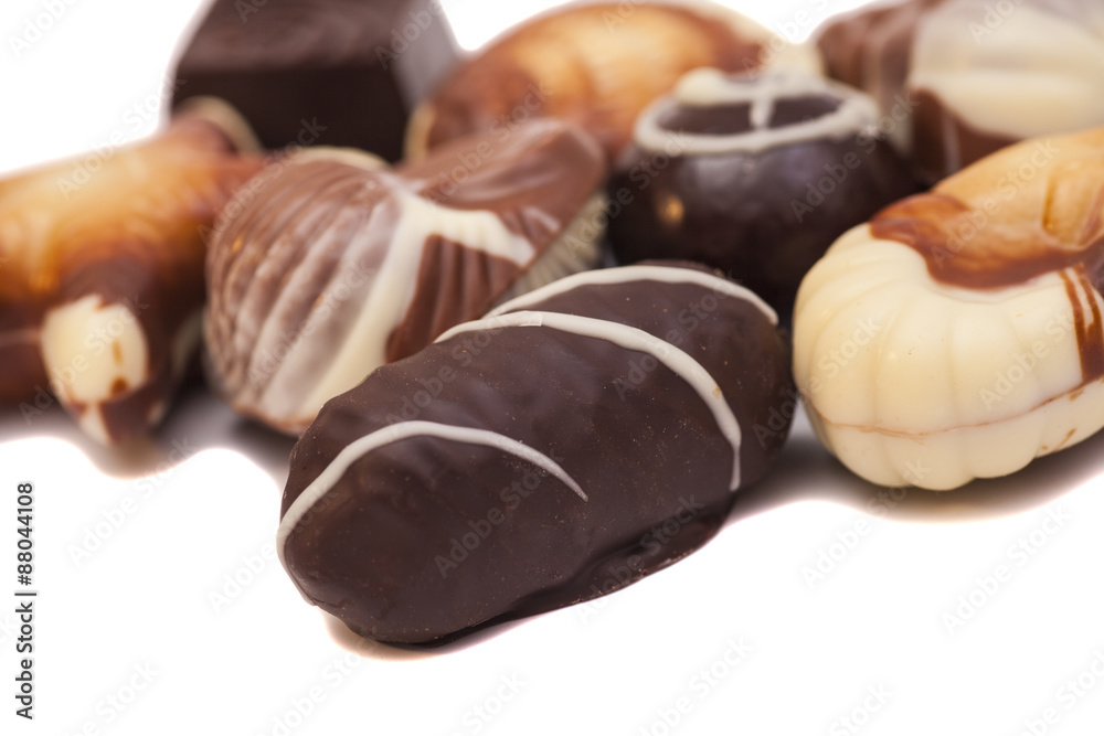 An assortment chocolates isolated on white An assortment chocolates isolated on white