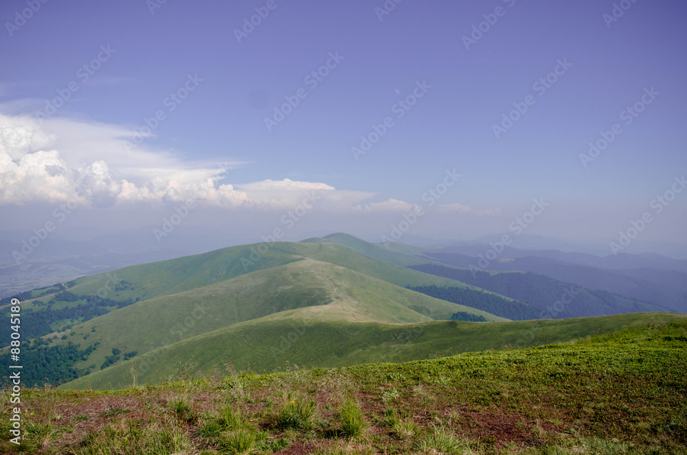 Beautiful green hills in a bright day. Travel background