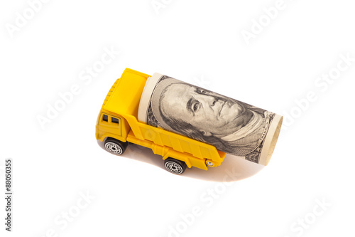 truck caries a roll of one hundred dollar bill isolated on white background 