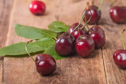 Sweet cherries with green leaves