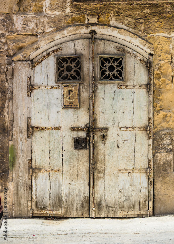 wooden garage doors in a street in Valletta