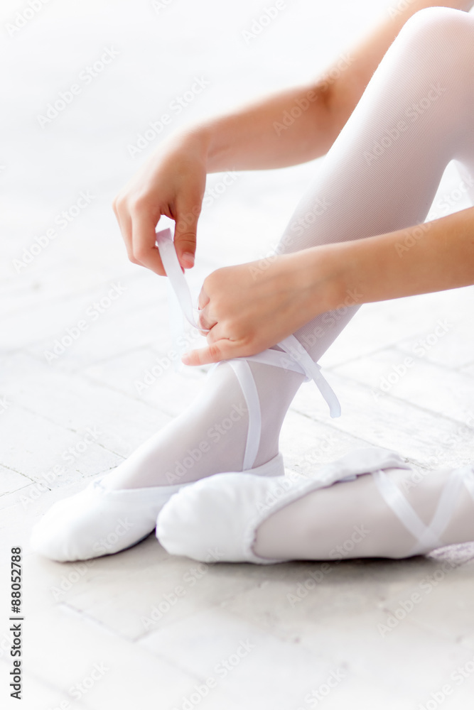 little ballerina puting on foot pointe shoes little ballerina puting on foot pointe shoes