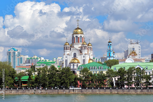 View of the Church on Blood, the Church of Christ's Ascension and the Patriarch's Metochion from the city pond of Yekaterinburg, Russia photo