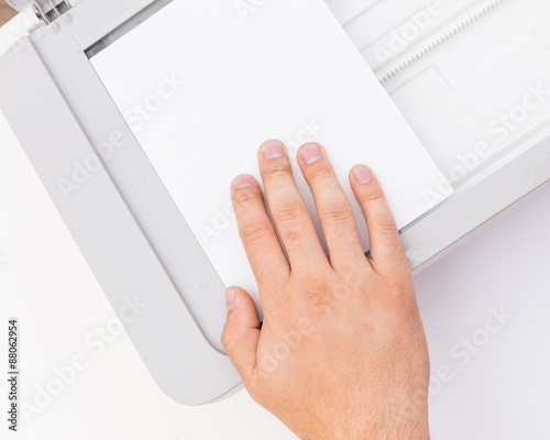 Man's hand working with printer