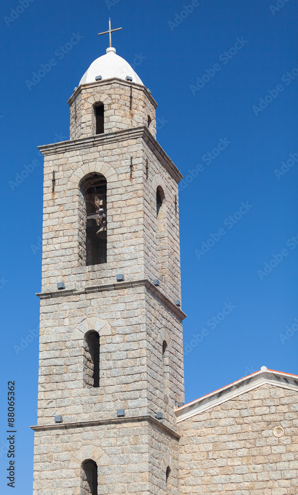 Bell tower of Propriano church, gray stone facade