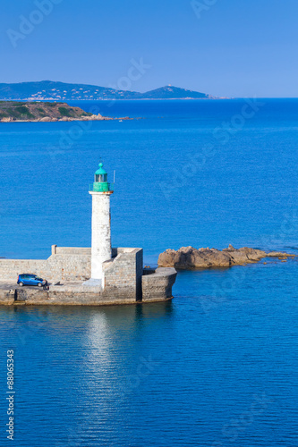 Old lighthouse on the pier, entrance to Propriano port