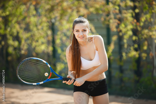 young sporty girl playing tennis