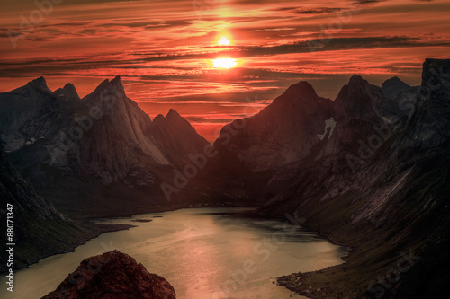 Midnight sun over Reinebringen. Summer in the Lofoten in Norway
