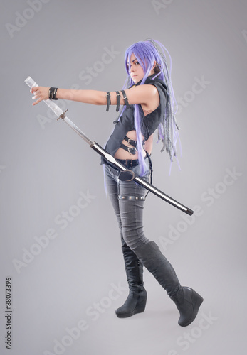 Fényképezés Female fantasy warrior / Female warrior with sword isolated on the gray backgrou