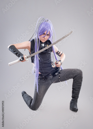 Photography Female fantasy warrior / Female warrior with sword isolated on the gray backgrou