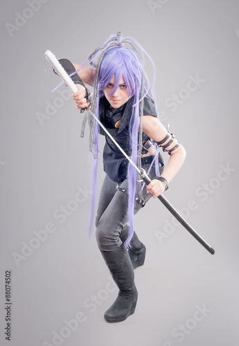 Obraz na płótnie Female fantasy warrior / Female warrior with sword isolated on the gray backgrou