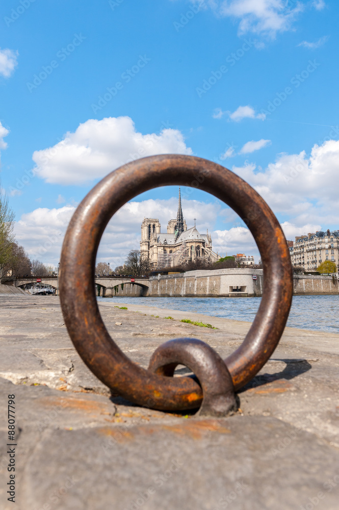 blurred view of Notre Dame trough Ring for anchoring boats along the Seine river blurred view of Notre Dame trough Ring for anchoring boats along the Seine river