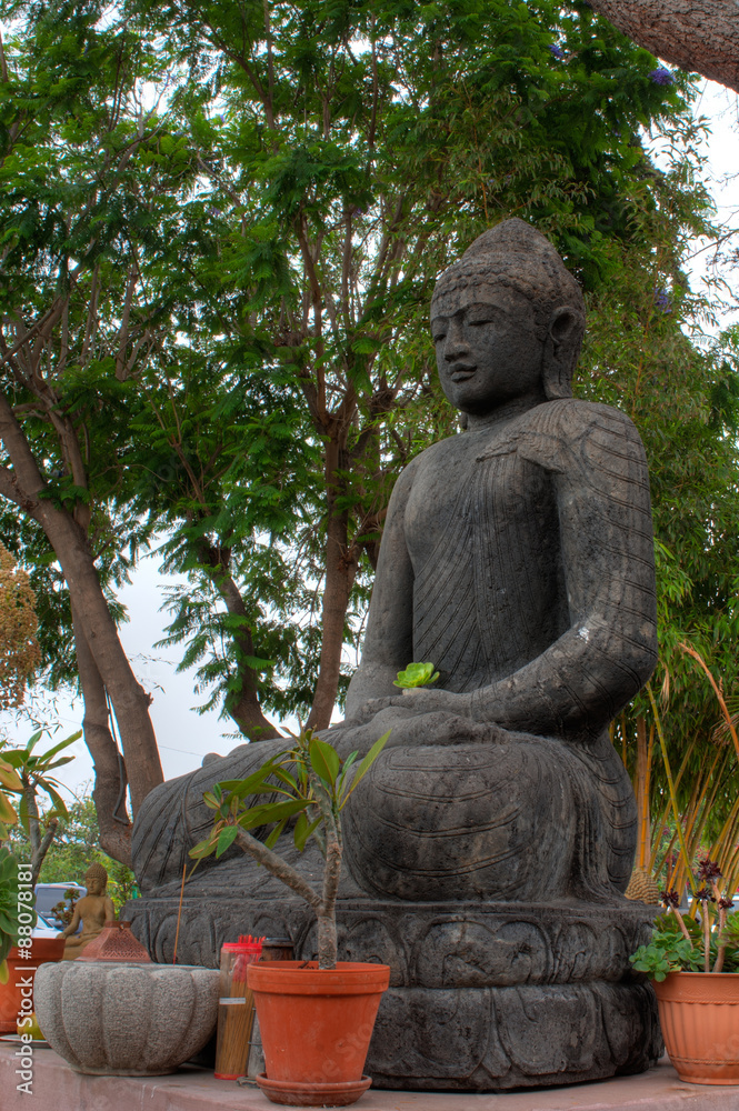 Large statue of Buddha Amitabha in seated position.