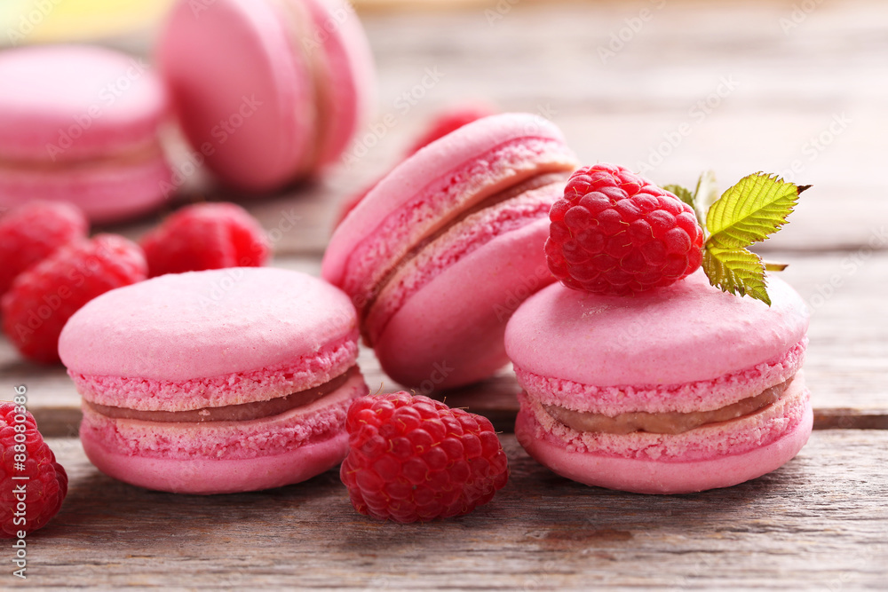 Raspberry macarons on grey wooden background Raspberry macarons on grey wooden background